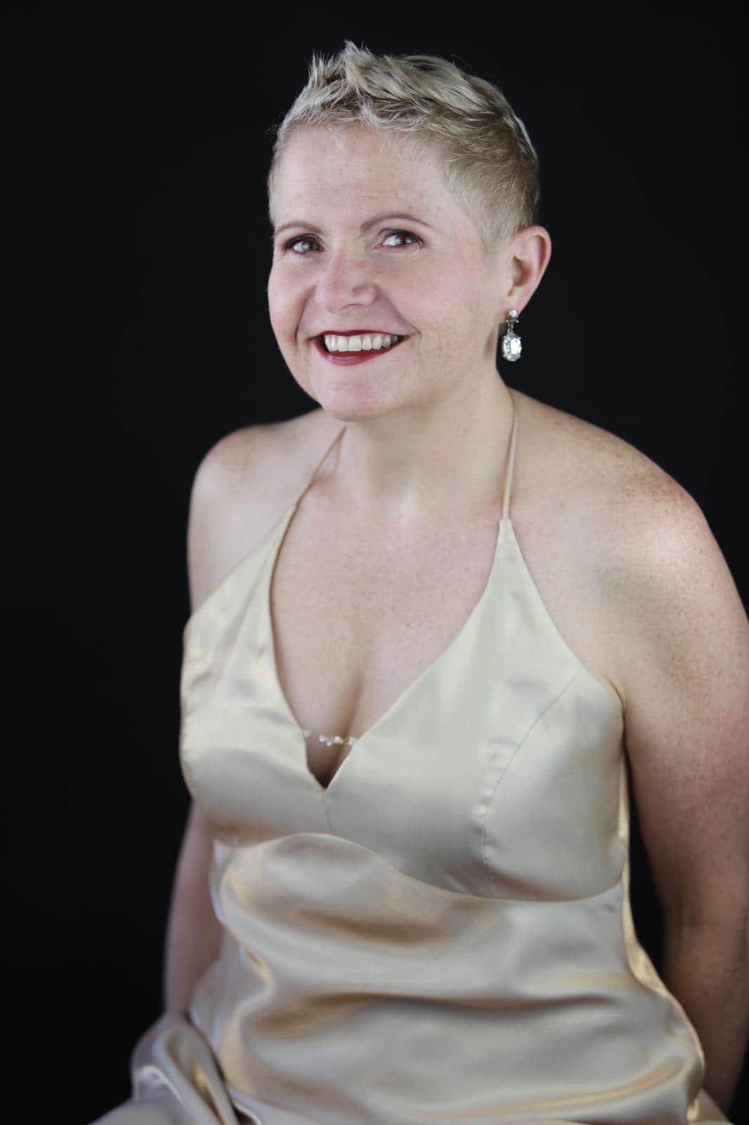 A portrait of Sharon in a white dress